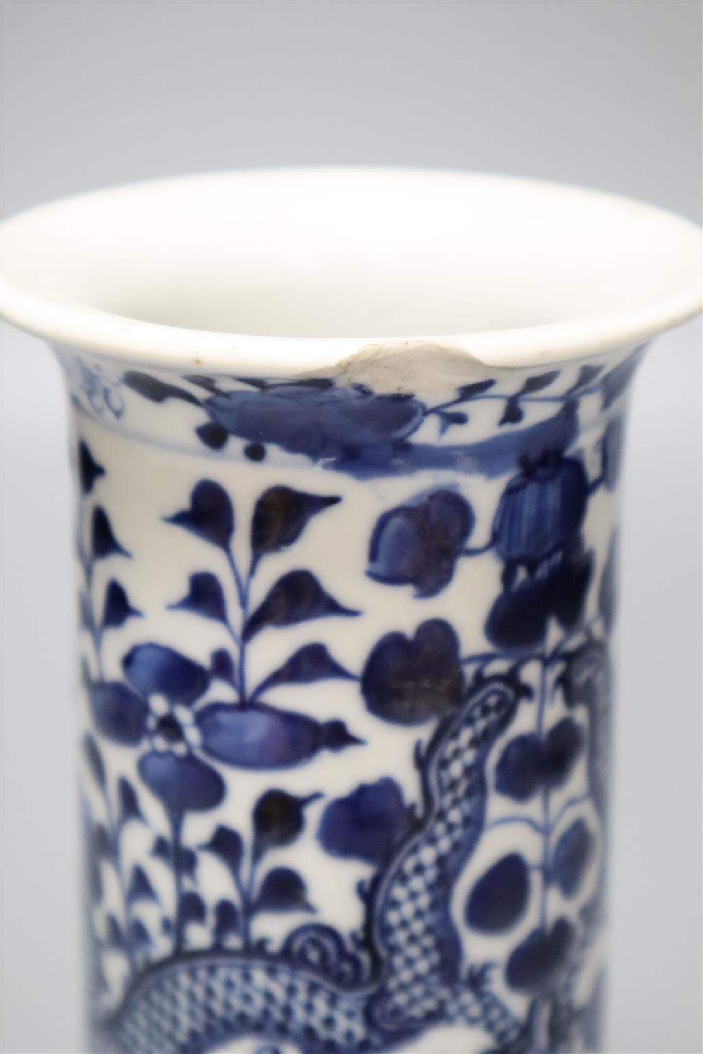 A Chinese blue and white seal paste box and cover, Yongzheng mark but 19th century, and a blue and white cylindrical dragon sleeve vase